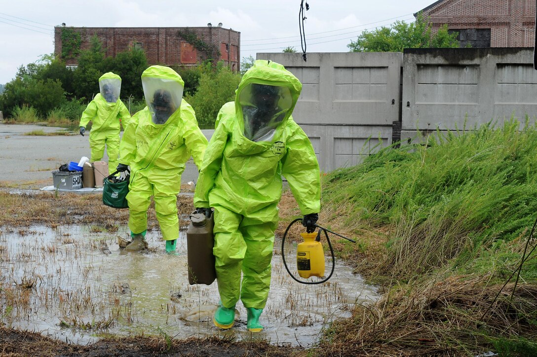 U.S. Air Force Airmen assigned to the 633rd Civil Engineer Squadron Explosives Ordinance Disposal flight, participate in a simulated chemical unexploded ordnance evaluation training during Operation Llama Fury three point zero at Joint Base Langley-Eustis, Virginia., August 8, 2017.