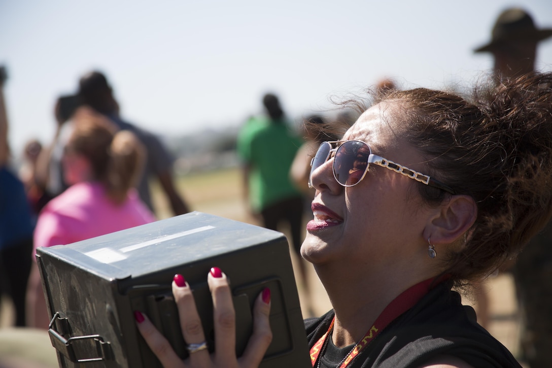 Adrianna Torres, a teacher at Garland High School in Garland, TX, does ammo can lifts during the combat fitness test at Marine Corps Recruit Depot San Diego, August 8, 2017. The workshop is a four-day program designed to better inform high school and college educators about the benefits and opportunities available during service in the Marine Corps. This allows the attendees to return to their place of business and provide firsthand experience and knowledge with individuals interested in military service.
