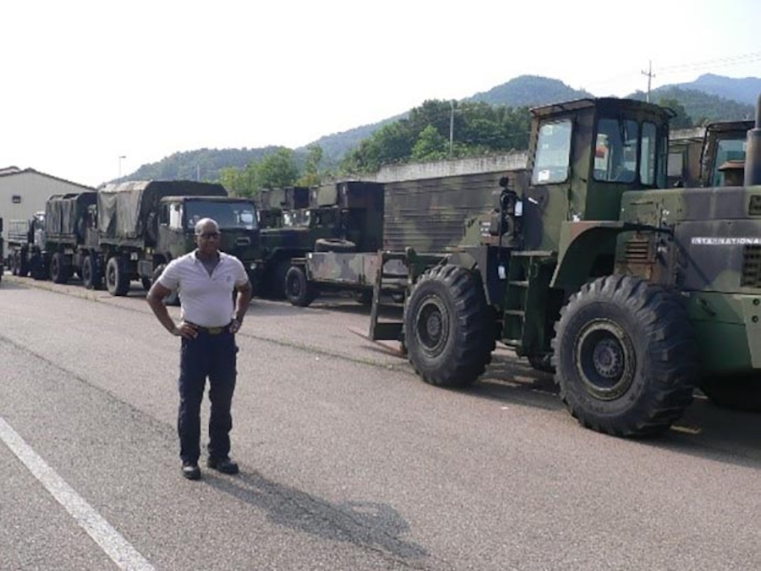Area Manager Terry Harrington surveys some of the vehicles being turned in through DLA Disposition Services at Gimcheon as part of the Class II and Class VII Excess Reduction.