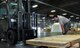 Senior Airman David Stevens, 60th Aerial Port Squadron, directs Senior Airman Nathan Jarvis, a 39th APS cargo processing technician and traditional reservist, on the use of a forklift as Jarvis manipulates heavy cargo at Travis Air Force Base, Calif., July 11, 2017. Jarvis is one of the 15 Reserve Citizen Airmen from the 39th Aerial Port Squadron, stationed at Peterson Air Force Base, Colo., who trained with their active duty counteparts at Travis AFB during an annual tour. (U.S. Air Force photo/Staff Sgt. Frank Casciotta)