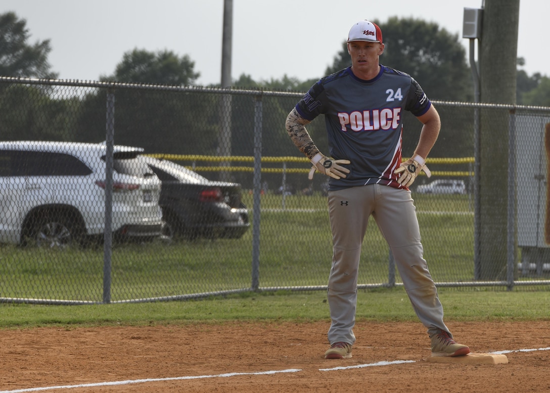 U.S. Air Force Staff Sgt. Jeremy White, 633rd Security Forces Squadron vehicle control NCOIC, waits on third base as his teammate bats during the Intramural Softball Championship at Joint Base Langley-Eustis, Virginia., August 1, 2017.
