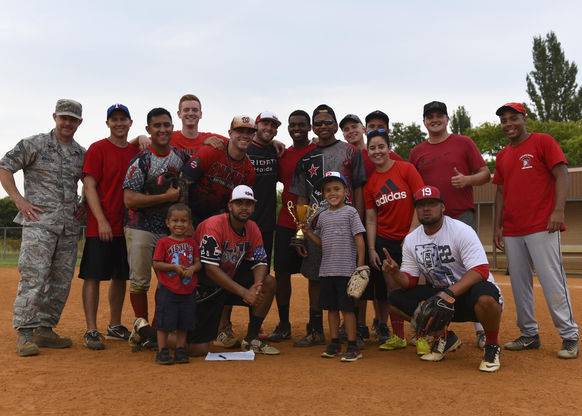 Members of the 30th Intelligence Squadron pose for a group photo after the Intramural Softball Championship at Joint Base Langley-Eustis, Virginia., August 1, 2017.