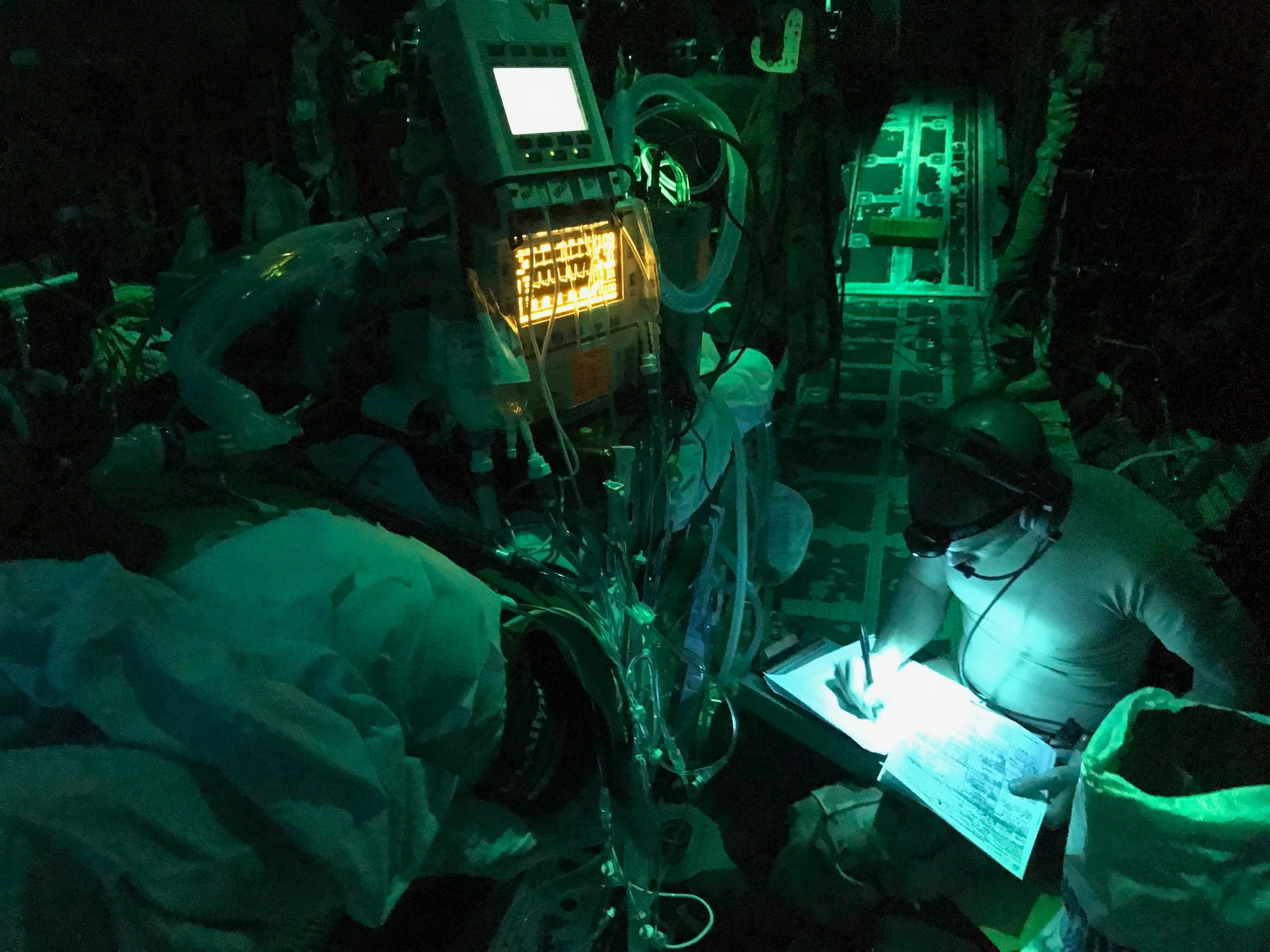 Members of the 455th Expeditionary Aeromedical Evacuation Squadron provide care for U.S. Army Soldiers who were wounded in a rocket propelled grenade attack in a C-130J Super Hercules during a flight to Bagram Airfield, Afghanistan June 17, 2017. The Soldiers underwent 12 hours of trauma care at Craig Joint Theater Hospital at Bagram before they were flown to Germany by a C-17 Globemaster III from Travis Air Force Base, Calif. (Courtesy Photo)