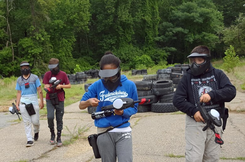Teens finish their first round of team elimination at the Combat Town course at the Paintball Park at Quantico.