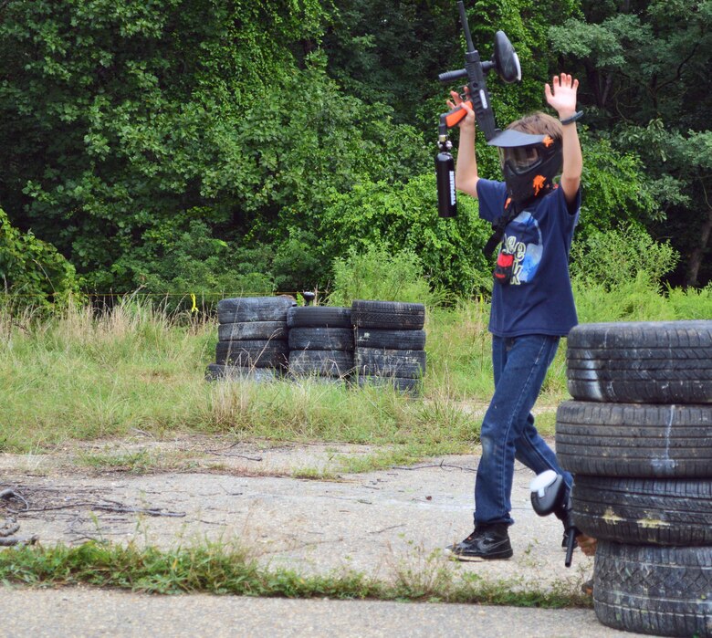 After taking three shots to the face teen surrenders during around of team elimination at the Paintball Park at Quantico - Combat Town.