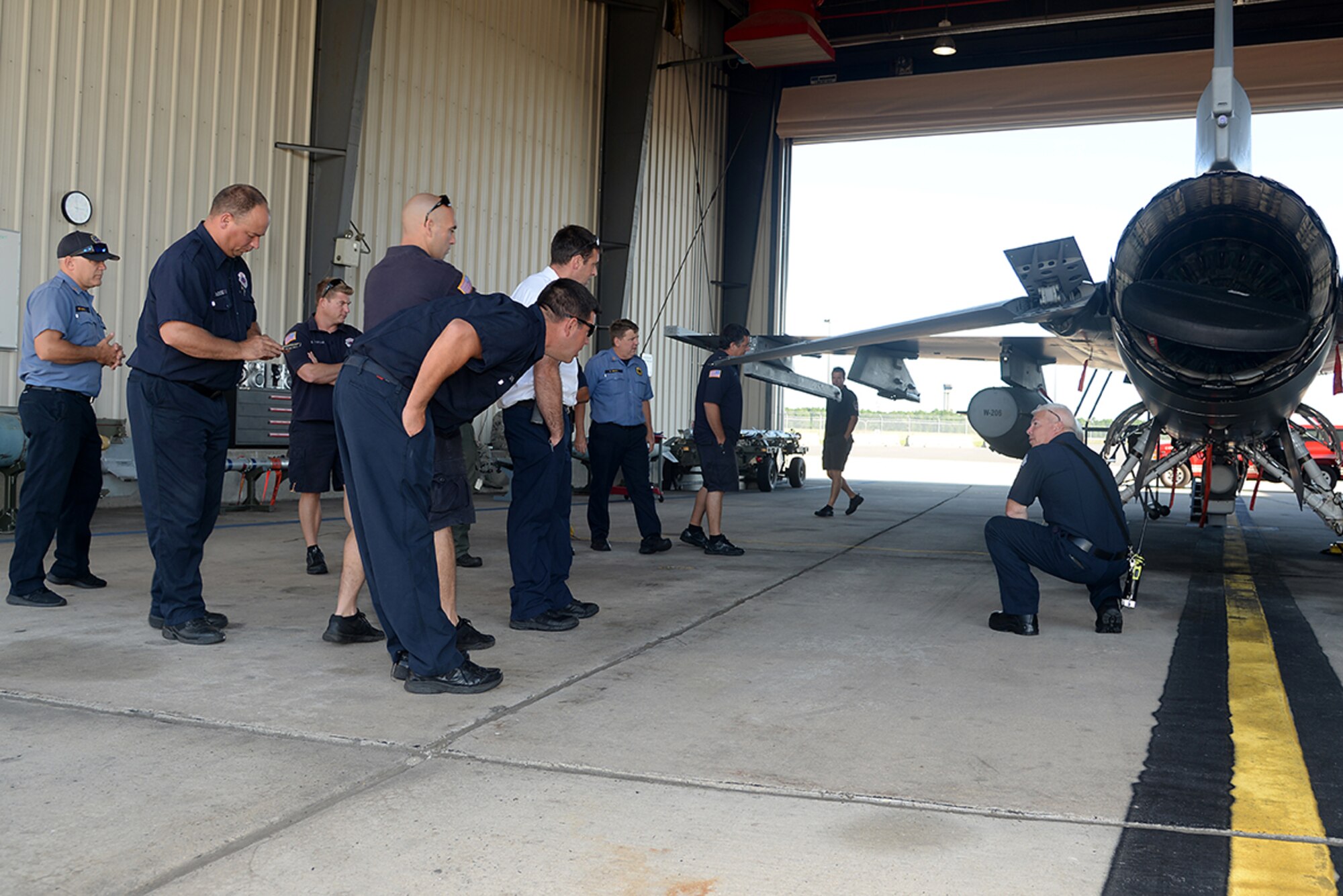 A picture of William Ferguson, a captain with the 177th Fighter Wing’s Fire Department, providing F-16 familiarization training to the Atlantic City Fire Department and the New Jersey State Police Technical Emergency and Mission Specialist Unit at the 177th Fighter Wing Fire Station.