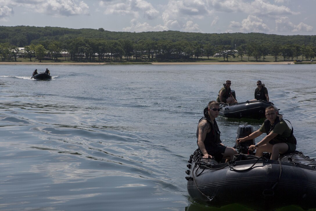 A Sikorsky SH-60 Seahawk with Helicopter Sea Combat Squadron 22, departs after inserting U.S. Marines with Echo Company, 4th Reconnaissance Battalion, 4th Marine Division, Marine Forces Reserve into Lake Margrethe, Camp Grayling Joint Maneuver Training Center, Michigan on July 31, 2017.