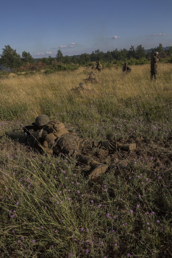 CAMP GRAYLING, Mich. – U.S. Marines with Charlie Company, 1st Battalion, 25th Marine Regiment, 4th Marine Division, Marine Forces Reserve provide security at a multi-purpose range complex within the Camp Grayling Joint Maneuver Training Center, Michigan on Aug. 1, 2017. Reserve Marines conducted reinforced platoon attacks to suppress enemy positions in order to breach and clear obstacles and allow movement toward the objective during Exercise Northern Strike 17. Exercise Northern Strike is a National Guard Bureau-sponsored training exercise that unites service members from multiple branches, states and coalition countries to conduct combined ground and air combat operations. (U.S. Marine Corps photo by Lance Cpl. Imari J. Dubose/Released).