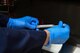 Senior Airman Josef Ansorge, 2nd Medical Group laboratory technician, inserts a cotton swab into a sample container before placing it in a petri dish at Barksdale Air Force Base, La., Aug. 2, 2017. The Petri dishes give laboratory technicians the ability to grow bacteria used to diagnose patients. (Photo/ Samantha Maiette)