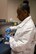 Master Sgt. Nordyica Woodfork, 2nd Medical Group laboratory technician, removes a specimen from a collected sample at Barksdale Air Force Base, La., Aug. 2, 2017. Barksdale’s laboratory technicians collected over 154,819 specimens for analysis within the past 12 months, performing 118,192 tests locally within the medical group. (Photo/ Samantha Maiette)
