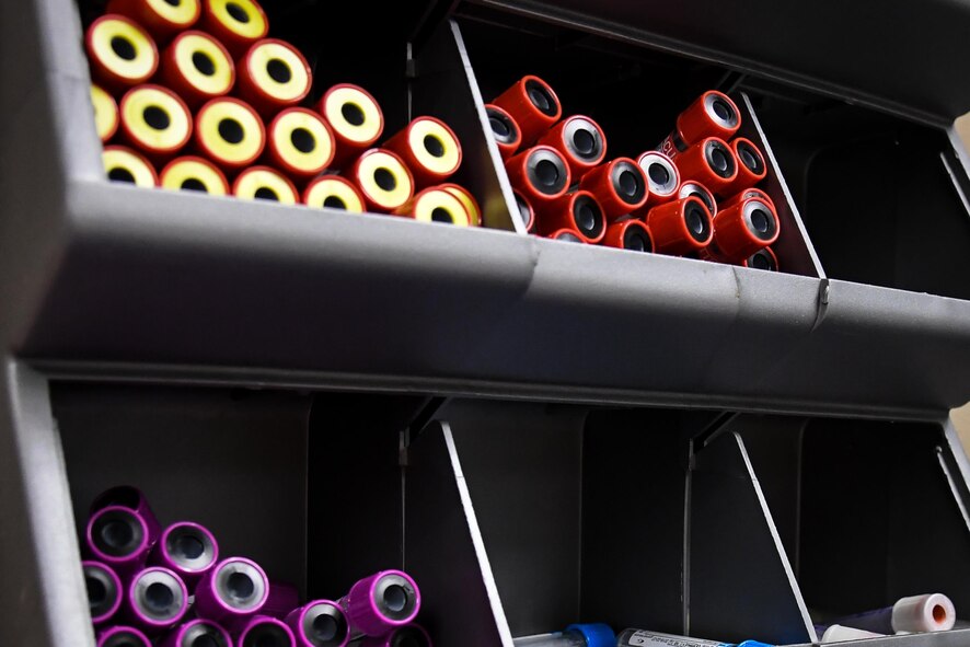 Vials used for collecting blood samples are displayed in a wall storage container at Barksdale Air Force Base, La., Aug. 2, 2017.