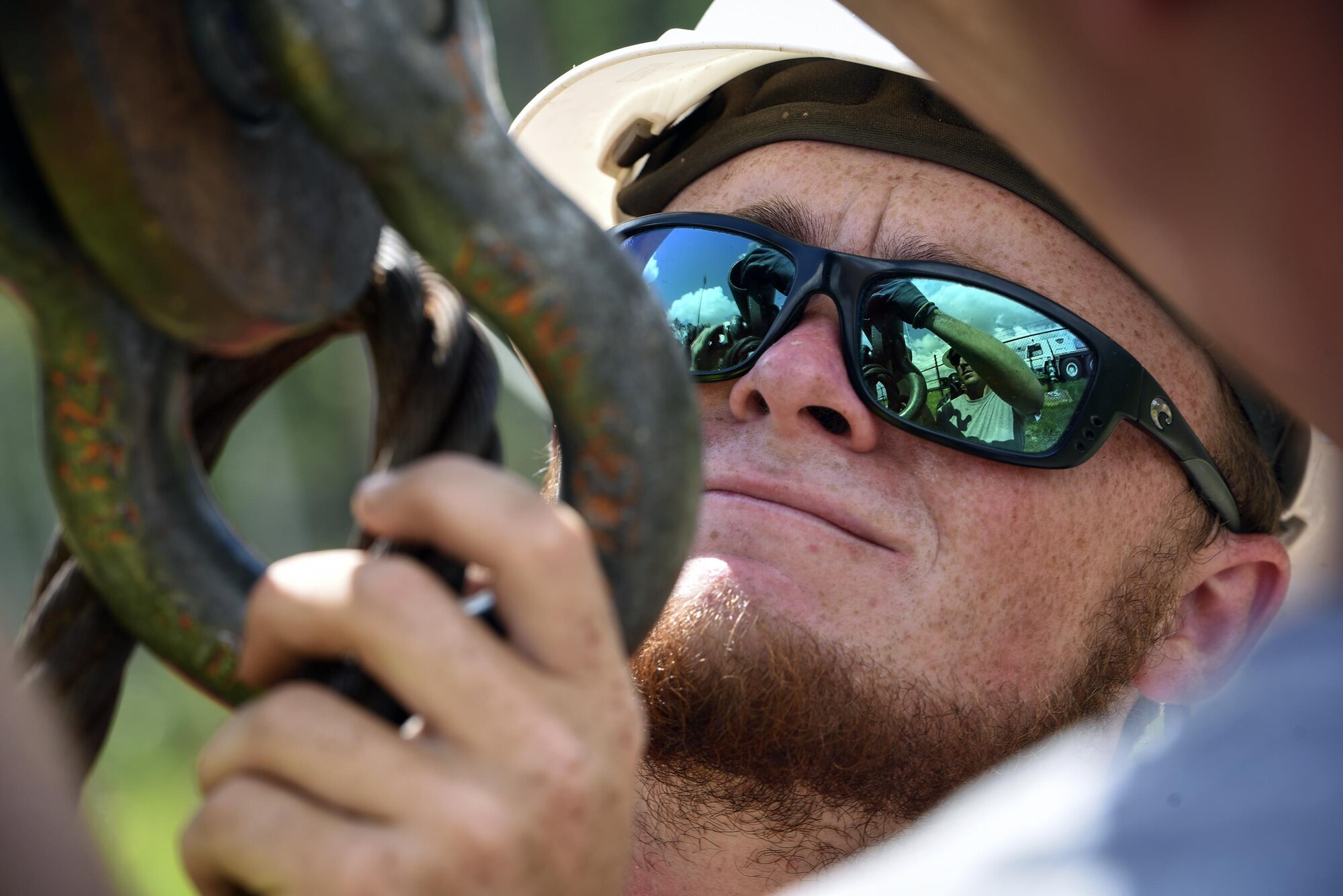 Nick Giles, a local electrician, hooks in light fixture components to stand up adjacent to Moody’s hot cargo pad during a base-wide high efficiency lighting project, Aug. 7, 2017, at Moody Air Force Base, Ga. As part of the Department of Defense’s Energy Conservation Investment Program, the 23d Civil Engineer Squadron and local contractors conducted $3.6 million worth of repairs and replacements for the entire installation’s exterior and interior lighting. (U.S. Air Force photo by Senior Airman Greg Nash)