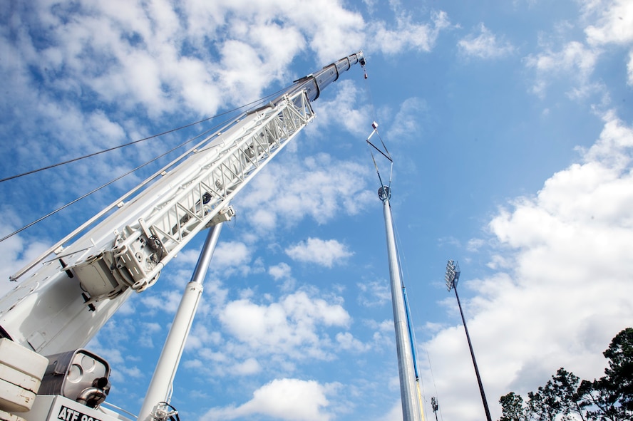 One of 14 new airfield security ramp light poles, centered, stands adjacent to the hot cargo pad, as a part  of a base-wide, high efficiency lighting project, Aug. 7, 2017, at Moody Air Force Base, Ga. As part of the Department of Defense’s Energy Conservation Investment Program, the 23d Civil Engineer Squadron and local contractors conducted $3.6 million worth of repairs and replacements for the entire installation’s exterior and interior lighting. (U.S. Air Force photo by Senior Airman Greg Nash)