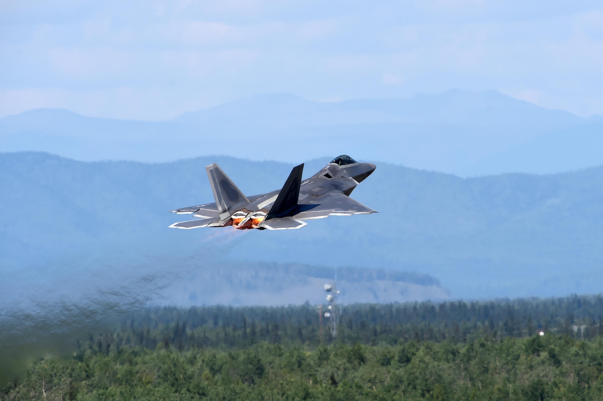 A U.S. Air Force F-22 Raptor takes off for training during exercise Arctic ACE, Alaska, July 17, 2017. The first of its kind, Arctic ACE was designed to exercise Pacific Air Force’s Agile Combat Employment concept of operations, or ACE, by concurrently conducting fifth-generation fighter operations from a main operating base and a forward, austere operating base.