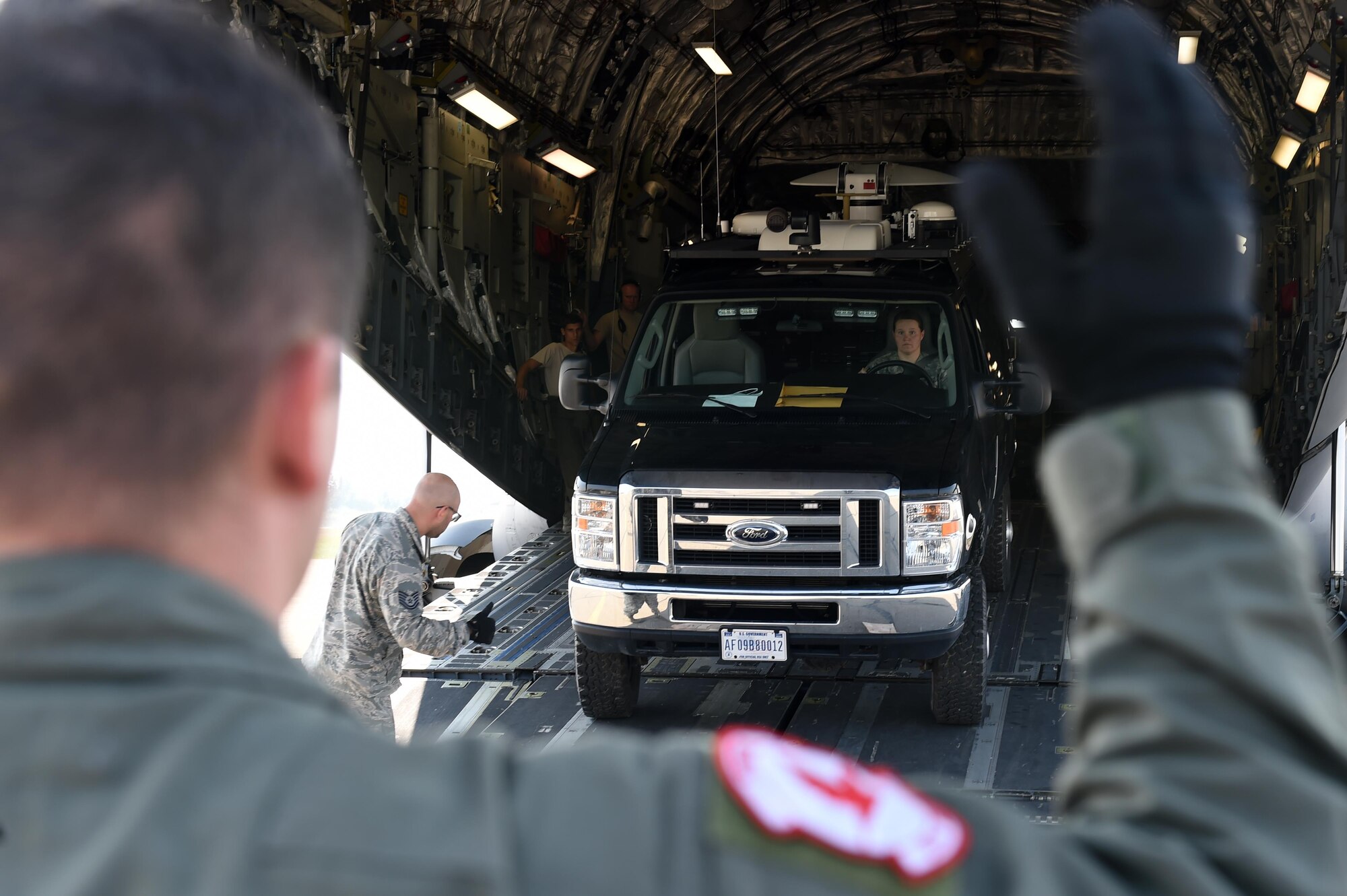 A U.S. Air Force loadmaster with the 517th Airlift Squadron, Joint Base Elmendorf-Richardson, unloads a communications van off of a C-17 Globemaster III during exercise Arctic ACE, Alaska, July 14, 2017. The first of its kind, Arctic ACE was designed to exercise Pacific Air Force’s Agile Combat Employment concept of operations, or ACE, by concurrently conducting fifth-generation fighter operations from a main operating base and a forward, austere operating base.