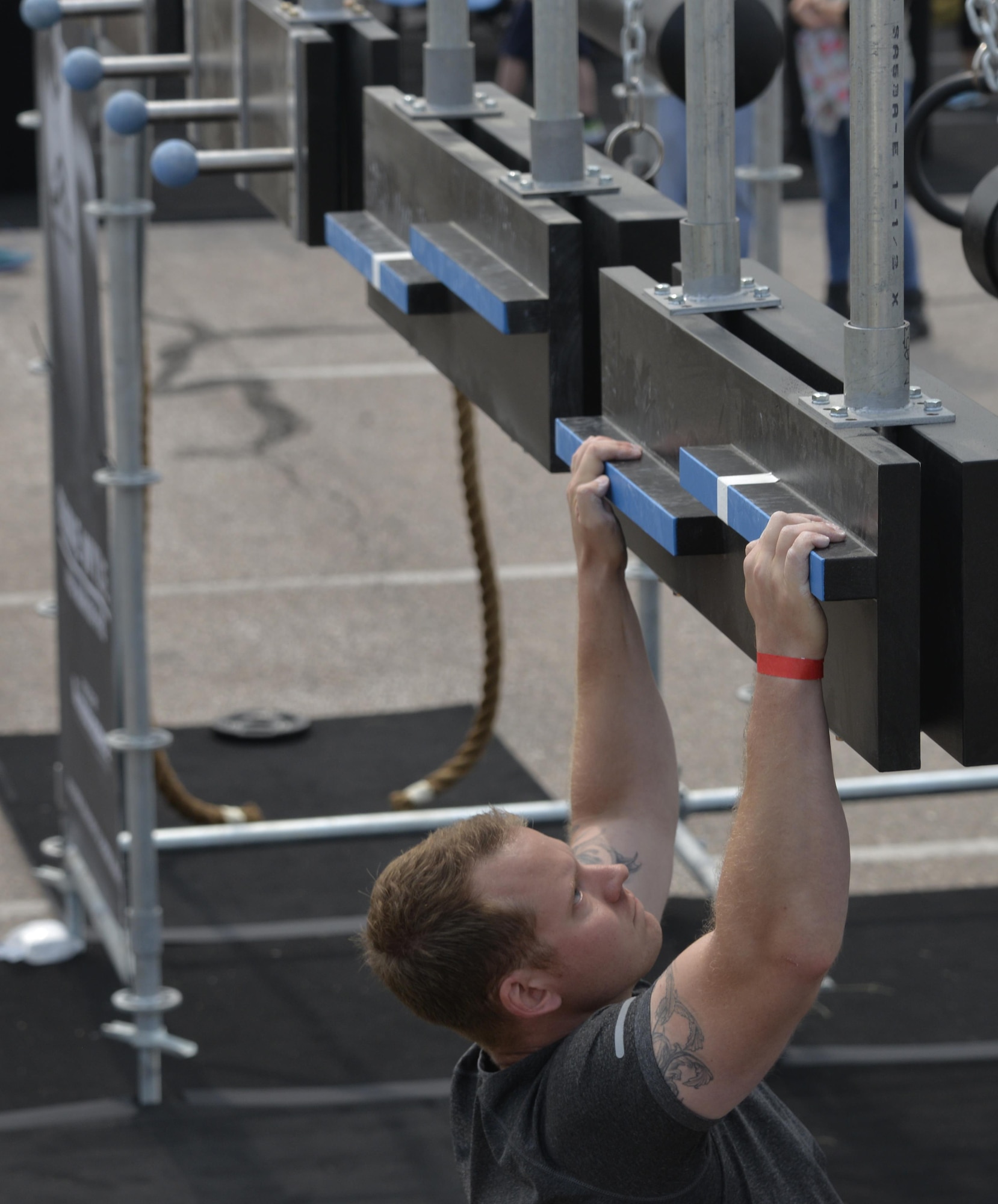 An Ellsworth Airman works to complete the Alpha Warrior Battle Rig at Ellsworth Air Force Base, S.D. Aug. 5, 2017.  The Alpha Warrior Battle Rig required participants to use more than just their brawn, it also tested their endurance, resiliency and will power. (U.S. Air Force photo by Airman 1st Class Michella T. Stowers)