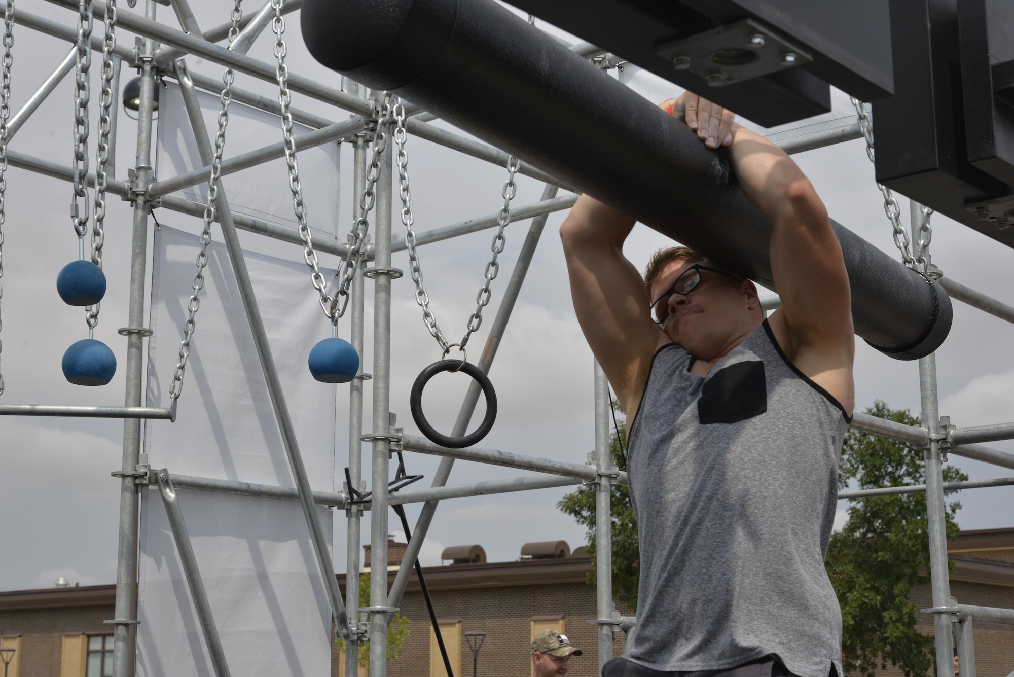 Airman 1st Class Bradley Borytsky, a mental health technician assigned to the 28th Medical Operations Squadron, tackles the third obstacle of the Alpha Warrior Battle Rig at Ellsworth Air Force Base, S.D. on Aug. 5, 2017. Borytsky placed number three out of 11 male competitors, the top male and female from their regions will go on to compete at Joint Base San Antonio, Texas. (U.S. Air Force photo by Airman 1st Class Michella T. Stowers)