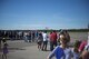 People from across the Fairbanks North Star Borough gather to watch an F-16 fighting Falcon aircraft assigned to the 18th Aggressor Squadron (AGRS) perform a maneuver during the Eielson Air Force Base, Alaska, Open House, August 5, 2017. The event featured U.S. Air Force, Army, Navy and Royal Canadian Air Force Assets, as well as a fly-over performed by the 18 AGRS. (U.S. Air Force photo by Airman 1st Class Isaac Johnson)