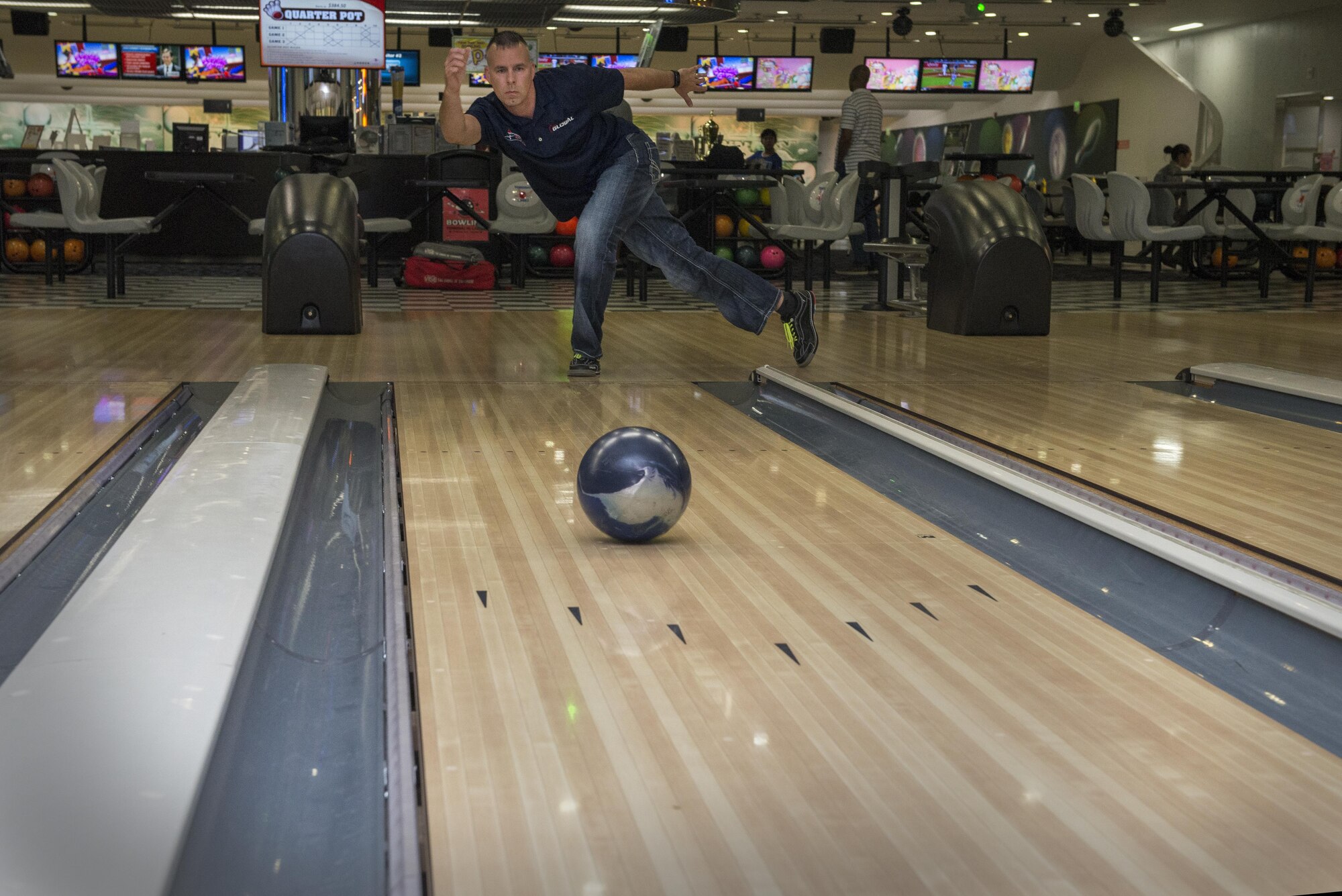 Tech. Sgt. Chuck Kropog, 374th Civil Engineer Squadron noncommissioned officer in charge of service contracts, bowls at Tomodachi Lanes, August 2, 2017, at Yokota Air Base, Japan.