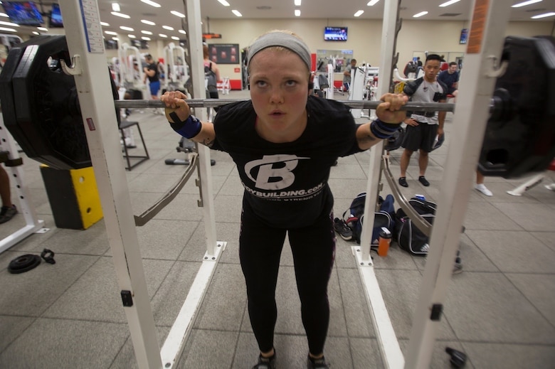 Lance Cpl. McKenzie A. Curtis prepares to squat 225 pounds Aug. 9 at Gunner’s Gym aboard Camp Foster, Okinawa, Japan.