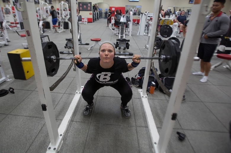 Lance Cpl. McKenzie A. Curtis squats 225 pounds at Gunner’s Gym Aug. 9 aboard Camp Foster, Okinawa, Japan.