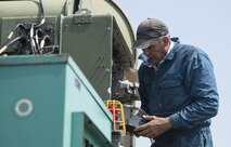 Steve Wagner, a Draughon Range electronic warfare field engineer, works on an unmanned threat emitter at Draughon Range at Misawa City, Japan, Aug. 2, 2017. Draughon Range personnel oversee the upkeep of the area including mechanical fixes. The workers put in approximately 65 hours per week to ensure the range functions at an optimal level. (U.S. Air Force photo by Airman 1st Class Sadie Colbert)