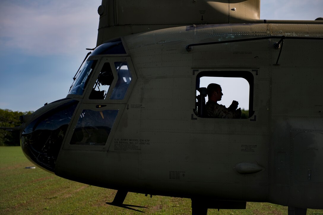 A U.S. Army Soldier awaits takeoff in a U.S. Army CH-47 Chinook during Leapfest, Aug. 6, 2017, in West Kingstown, R.I. The Rhode Island National guard hosted the 34th annual event, which is the largest international static line jump competition in the world. Team Moody’s Airmen represented the only U.S. sister-service team and earned second place among 70 participating teams. (U.S. Air Force photo by Airman 1st Class Daniel Snider)