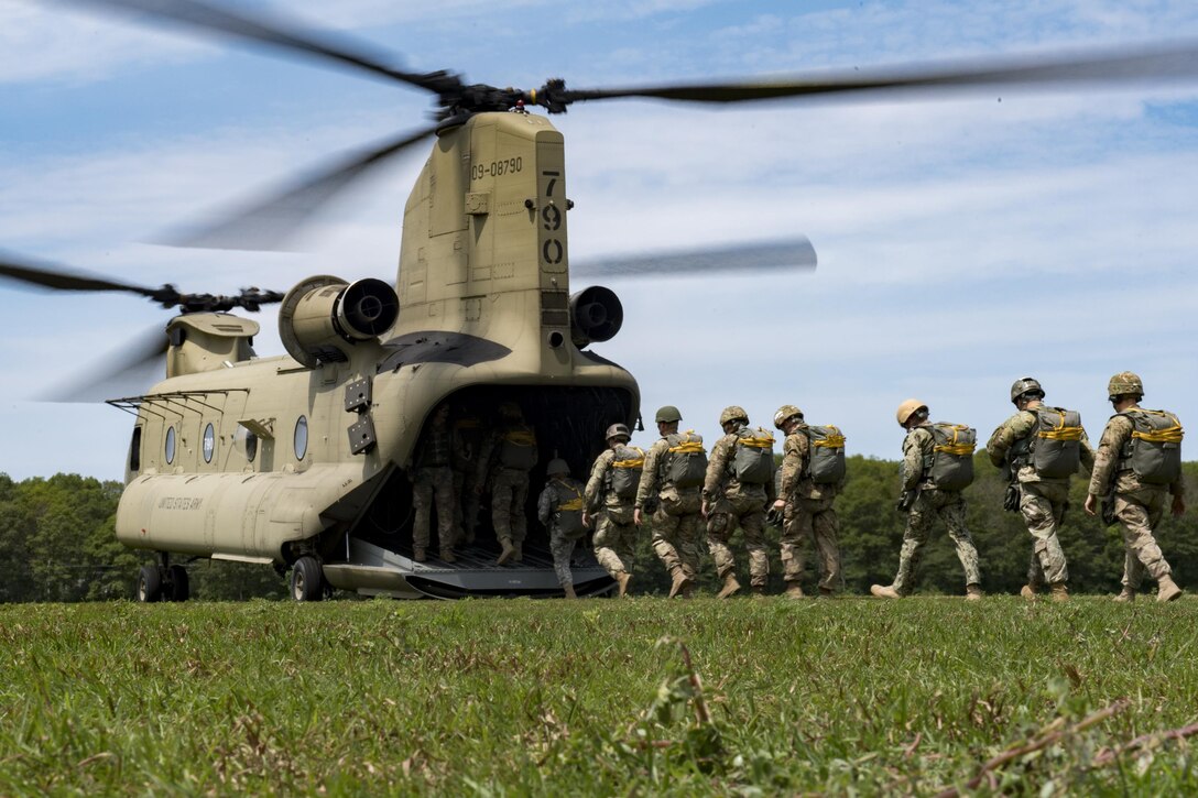 Paratroopers from around the world board a U.S. Army CH-47 Chinook during Leapfest, Aug. 6, 2017, in West Kingstown, R.I. The Rhode Island National guard hosted the 34th annual event, which is the largest international static line jump competi-tion in the world. Team Moody’s Airmen represent-ed the only U.S. sister-service team and earned second place among 70 participating teams. (U.S. Air Force photo by Airman 1st Class Daniel Snid-er)