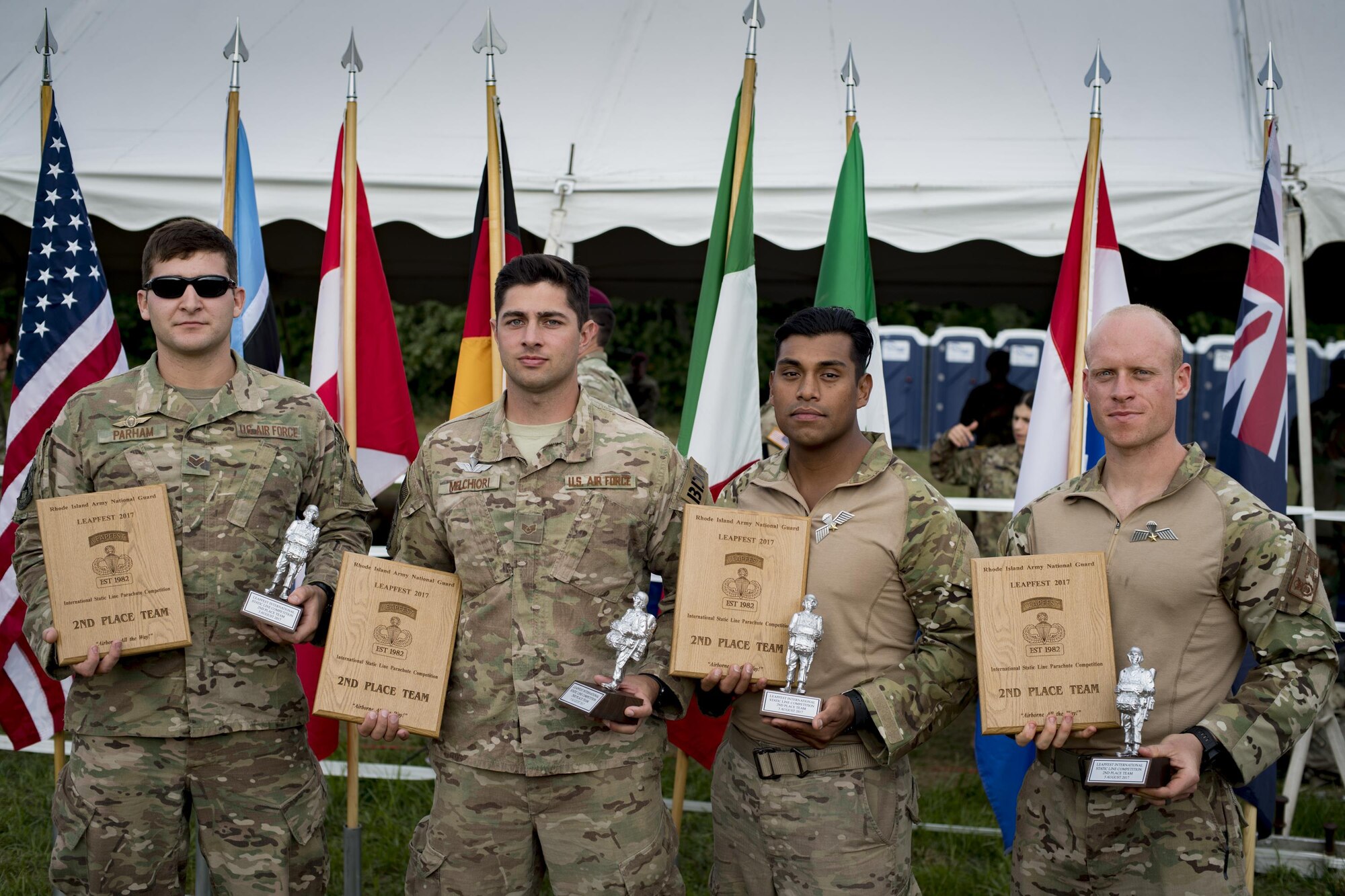 U.S. Air Force Senior Airman Preston Parham, 822d Base Defense Squadron fire team leader, left, Staff Sgt. Mark Melchiori, 822d BDS fire team leader, center left,Tech Sgt. Christopher Zavala, 822d BDS squad leader, center right, and Staff Sgt. Colt B. Crowe, 820th Base Defense Group parachute program manager, pose for a photo after winning second place at Leapfest, Aug. 6, 2017, in West Kingstown, RI. The Rhode Island National guard hosted the 34th annual event, which is the largest international static line jump competi-tion in the world. Team Moody’s Airmen represent-ed the only U.S. sister-service team and earned second place among 70 participating teams. (U.S. Air Force photo by Airman 1st Class Daniel Snider)