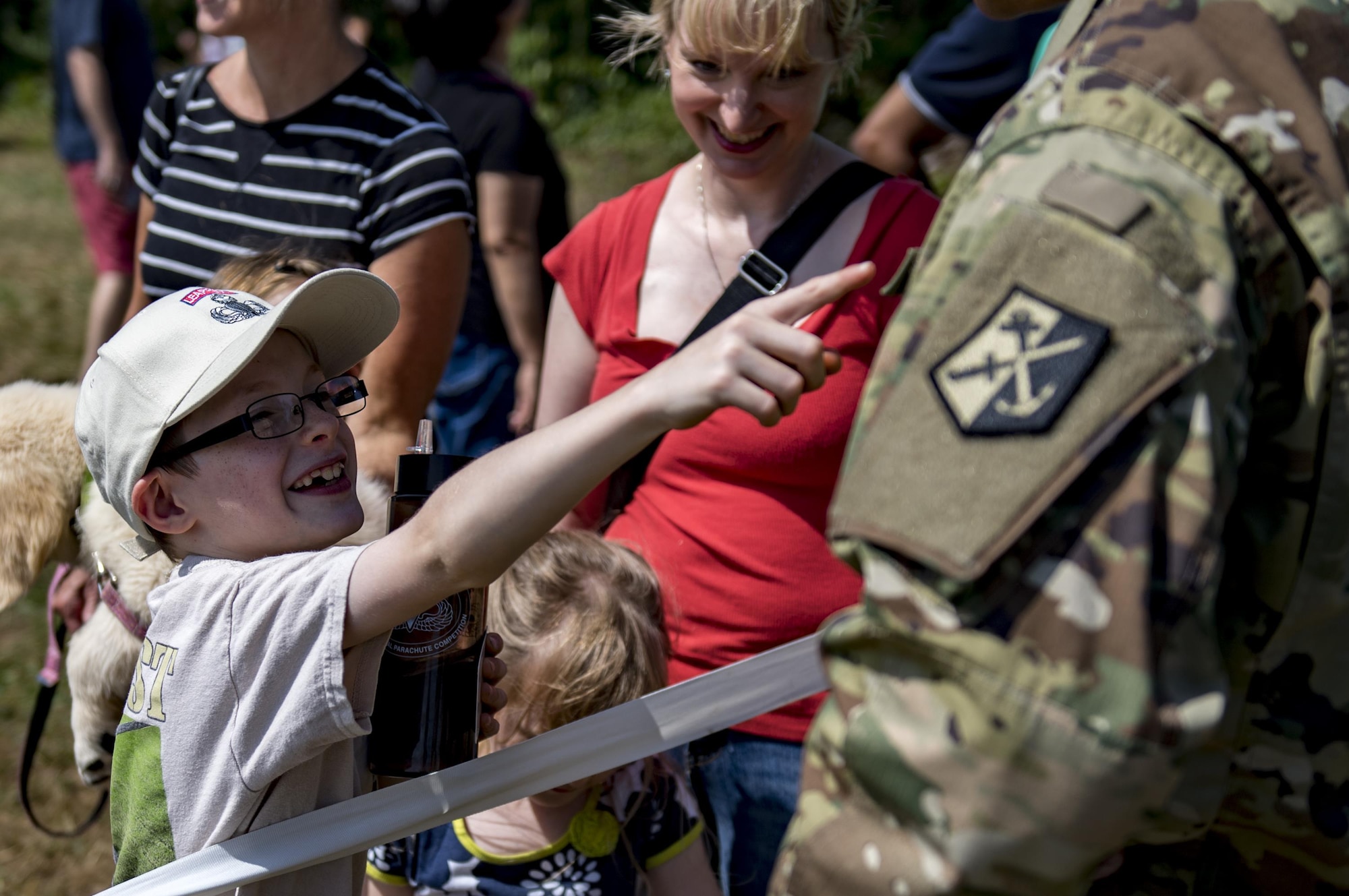 Nathaniel Dropek interacts with a U.S. Army Sol-dier during Leapfest, Aug. 6, 2017, in West Kings-town, R.I. The Rhode Island National guard hosted the 34th annual event, which is the largest interna-tional static line jump competition in the world. Team Moody’s Airmen represented the only U.S. sister-service team and earned second place among 70 participating teams. (U.S. Air Force photo by Airman 1st Class Daniel Snider)