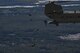 Paratroopers jump from a U.S. Army CH-47 Chi-nook during Leapfest, Aug. 6, 2017, in West Kingstown, R.I. The Rhode Island National guard hosted the 34th annual event, which is the largest international static line jump competition in the world. Team Moody’s Airmen represented the only U.S. sister-service team and earned second place among 70 participating teams. (U.S. Air Force photo by Airman 1st Class Daniel Snider)