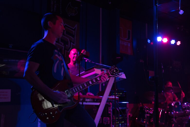 Tech. Sgt. John Kukan, the AFCENT Band NCOIC, takes the lead on guitar during an AFCENT Band performance at an undisclosed location in Southwest Asia, August 7, 2017. The band’s high energy show and follow-on live band karaoke brought 386th Air Expeditionary Wing members and joint Coalition partners together for two nights of fun, laughter and fellowship.