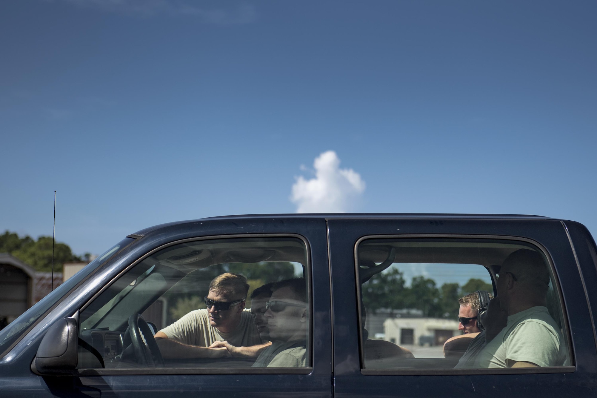 Maintainers from the 41st Helicopter Maintenance Unit catch a break from the heat in an air-conditioned truck, Aug. 8, 2017, at Tyndall Air Force Base, Fla.