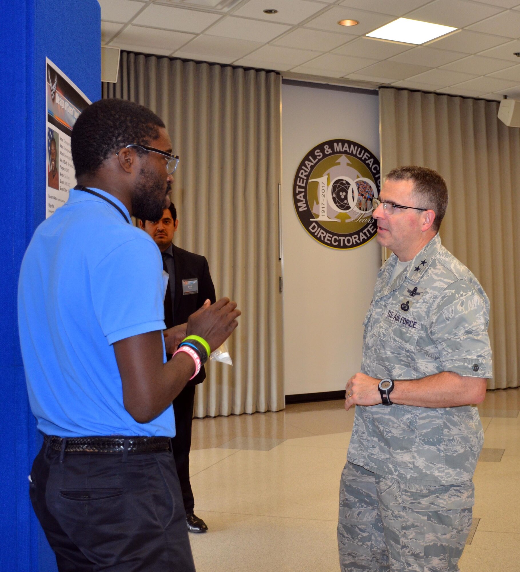 Summer students employed by the Materials and Manufacturing Directorate presented a culmination of their work at a poster session attended by leadership, mentors, and colleagues. (U.S. Air Force photo / Marisa Alia-Novobilski)