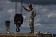 Airman 1st Class Nathaniel Norton, 52nd Civil Engineer Squadron heavy equipment operator, guides a crane into place to move parts for a replacement of an engine on a C-17 Globemaster III at Spangdahlem Air Base, Germany, Aug. 9, 2017. The 726th Air Mobility Squadron worked with the 52nd Logistics Readiness Squadron vehicle operations, 52nd Civil Engineer Squadron Dirt Boyz, and 721st Aircraft Maintenance Squadron in support of fixing the engine which takes an average of 12 hours to complete. (U.S. Air Force photo by Staff Sgt. Jonathan Snyder)