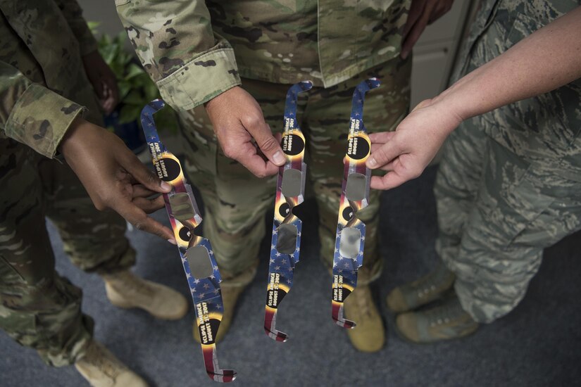 Members of the South Carolina National Guard show off their solar eclipse safety glasses in Columbia, S.C., Aug. 9, 2017. The glasses were distributed by the South Carolina National Guard Safety Office in preparation for the solar eclipse that will occur Aug. 21, 2017. Army National Guard photo by Spc. Chelsea Baker