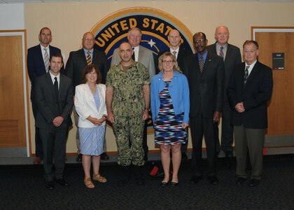 U.S. Navy Vice Adm. Charles Richard (front, center left), deputy commander of U.S. Strategic Command (USSTRATCOM), welcomes University of Nebraska Kearney (UNK) leaders to USSTRATCOM headquarters during their visit to Offutt Air Force Base, Neb., Aug. 9, 2017. While here, the UNK leaders received a briefing on USSTRATCOM’s missions and priorities, toured an RC-135 Rivet Joint aircraft and visited the new command and control facility. UNK is one of 38 local and national universities that have joined the USSTRATCOM Deterrence and Assurance Academic Alliance. The alliance was created to develop a community of interest and leverage expertise to research the concepts and practice of deterrence and assurance, as well as encourage the development of deterrence professionals to meet the nation's need for future generations of leaders. One of nine Department of Defense unified combatant commands, USSTRATCOM has global strategic missions assigned through the Unified Command Plan that include strategic deterrence, space operations, cyberspace operations, joint electronic warfare, global strike, missile defense, intelligence, and analysis and targeting.