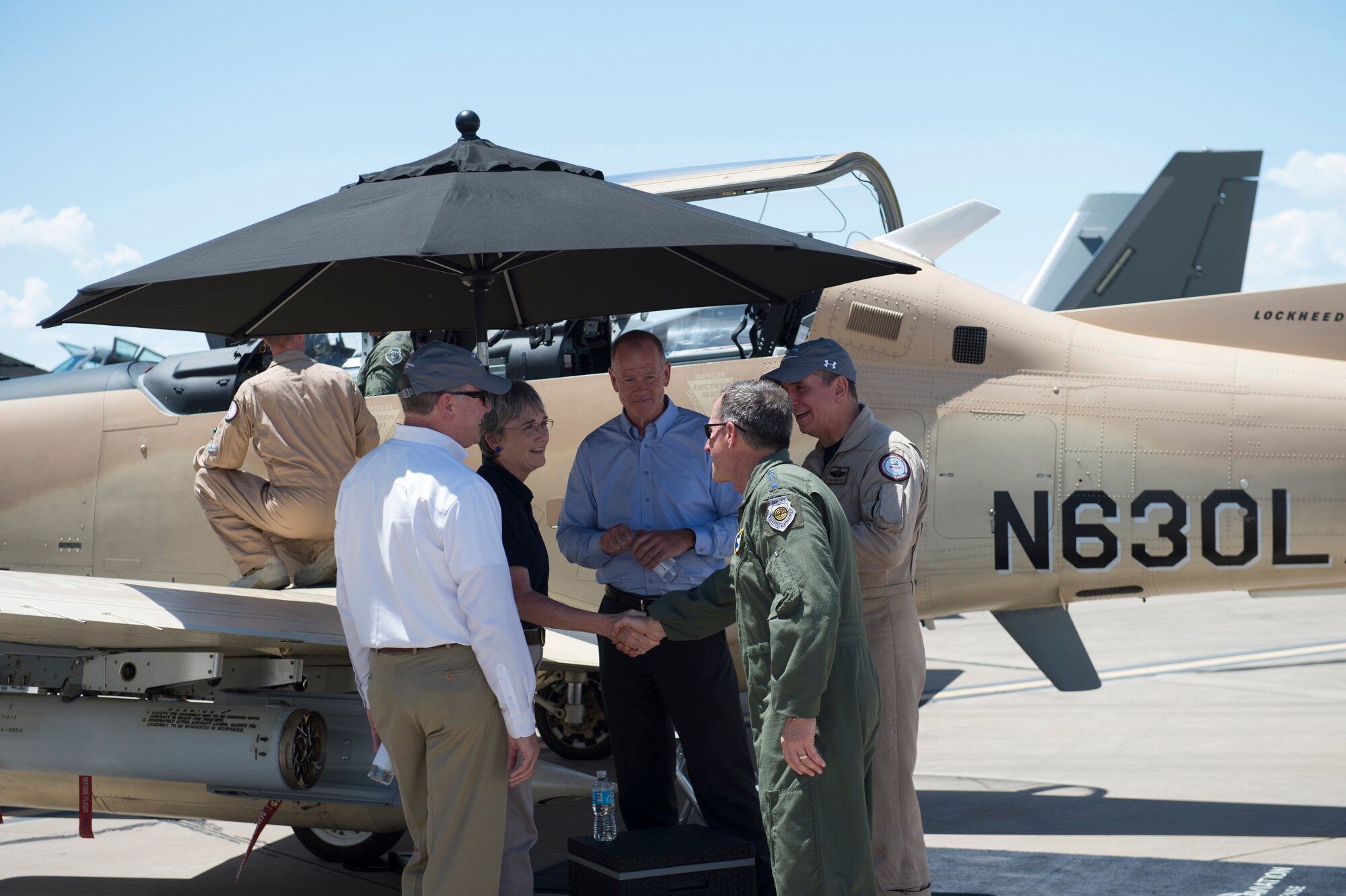 Secretary of the Air Force Heather Wilson meets with members from the Light Attack Experiment at Holloman Air Force Base, N.M., Aug. 9, 2017. Wilson had an immersion tour of Holloman and is here for a live-fly experiment with off-the-shelf aircraft. The Air Force is pursuing a Light Attack Capabilities Experimentation Campaign, which has grown out of our Close Air Support Experimentation Campaign. The Campaign is being led by the Air Force Strategic Development Planning and Experimentation Office under Air Force Materiel Command. (U.S. Air Force Airman 1st Class Alexis Docherty)