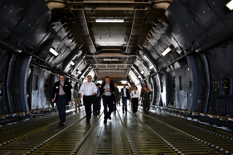Professionals from across industry, academia and government tour a C-5M Super Galaxy during a base visit as part of the Phoenix Collider event at Travis Air Force Base, Calif., Aug. 1, 2017. Phoenix Spark is a program modeled to bridge the challenges of rapid innovation at the unit-level while navigating the administrative hurdles of compliance that often impede the velocity of change.  (U.S. Air Force photo/Staff Sgt. Charles Rivezzo)