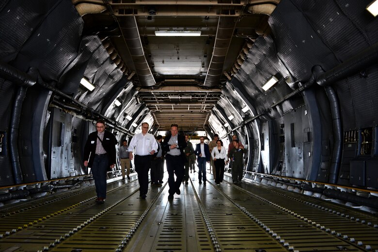 Professionals from across industry, academia and government tour a C-5M Super Galaxy during a base visit as part of the Phoenix Collider event at Travis Air Force Base, Calif., Aug. 1, 2017. Phoenix Spark is a program modeled to bridge the challenges of rapid innovation at the unit-level while navigating the administrative hurdles of compliance that often impede the velocity of change.  (U.S. Air Force photo/Staff Sgt. Charles Rivezzo)