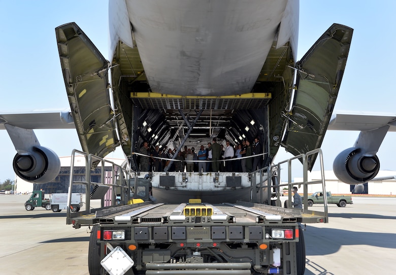 Professionals from across industry, academia and government tour a C-5M Super Galaxy during a base visit as part of a Phoenix Collider event at Travis Air Force Base, Calif., Aug. 1, 2017. Government and industry collaborations like Phoenix Collider are one of several avenues Phoenix Spark is pursuing to expand its footprint and develop solutions to enhance the lethality and efficiency of today’s warfighter. (U.S. Air Force photo/Staff Sgt. Charles Rivezzo)