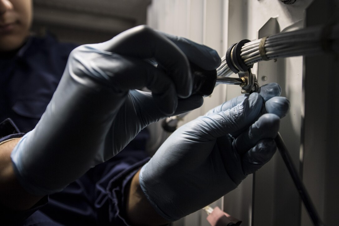 U.S. Air Force Senior Airman Edgar Gutierrez, 86th Maintenance Squadron fuel systems journeyman, works on a safety-wire inside the dry bay of a fuel tank for a C-130J Super Hercules on Ramstein Air Base, Germany, Aug. 8, 2017. Gutierrez and other 86th MXS Airmen worked on the C-130’s four main fuel tanks for 10 days to complete the aircraft’s 12-year inspection. (U.S. Air Force photo by Senior Airman Tryphena Mayhugh)