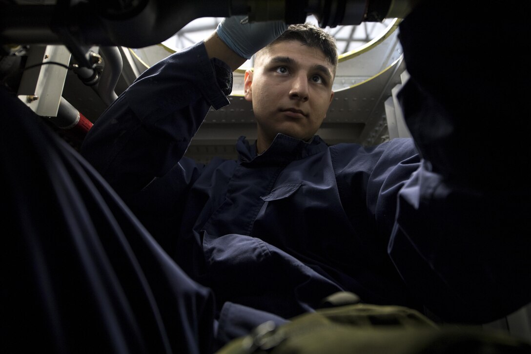 U.S. Air Force Senior Airman Edgar Gutierrez, 86th Maintenance Squadron fuel systems journeyman, repairs components inside the dry bay of a fuel tank for a C-130J Super Hercules on Ramstein Air Base, Germany, Aug. 8, 2017. C-130’s are required to undergo a full inspection of their four main fuel tanks every 12 years. (U.S. Air Force photo by Senior Airman Tryphena Mayhugh)