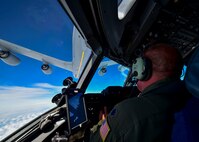 A YARS pilot watches as his C-17 Globemaster III receives fuel in flight by a KC-135R Stratotanker from Grissom AFB.