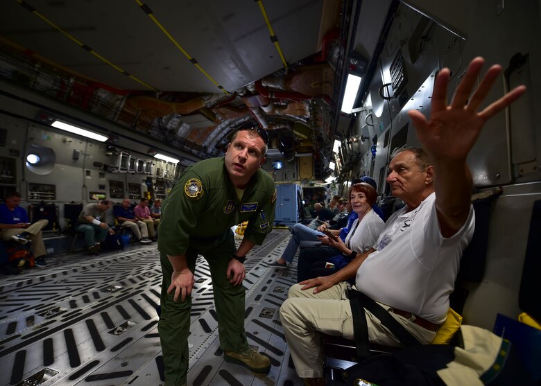 Tech. Sgt. Scott Schaffner, a loadmaster from the 89th AS, answers a question of a YARS civic leader July 28, 2017, aboard a C-17 on a flight to Colorado.