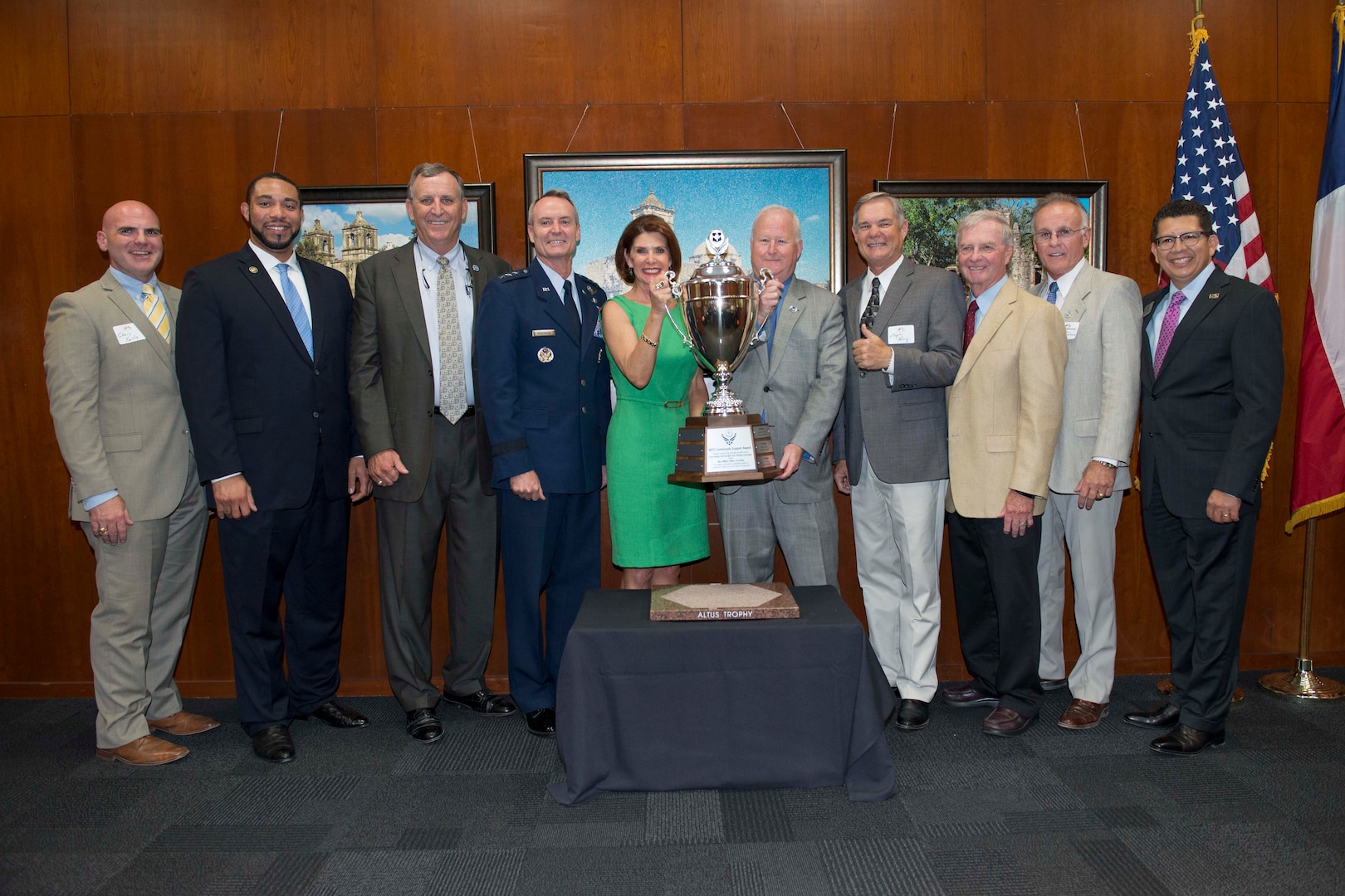 Air Education and Training Command leaders and San Antonio civic and business leaders pose with the Altus Trophy, which was present to San Antonio at the San Antonio Chamber of Commerce Aug. 8, 2017.
