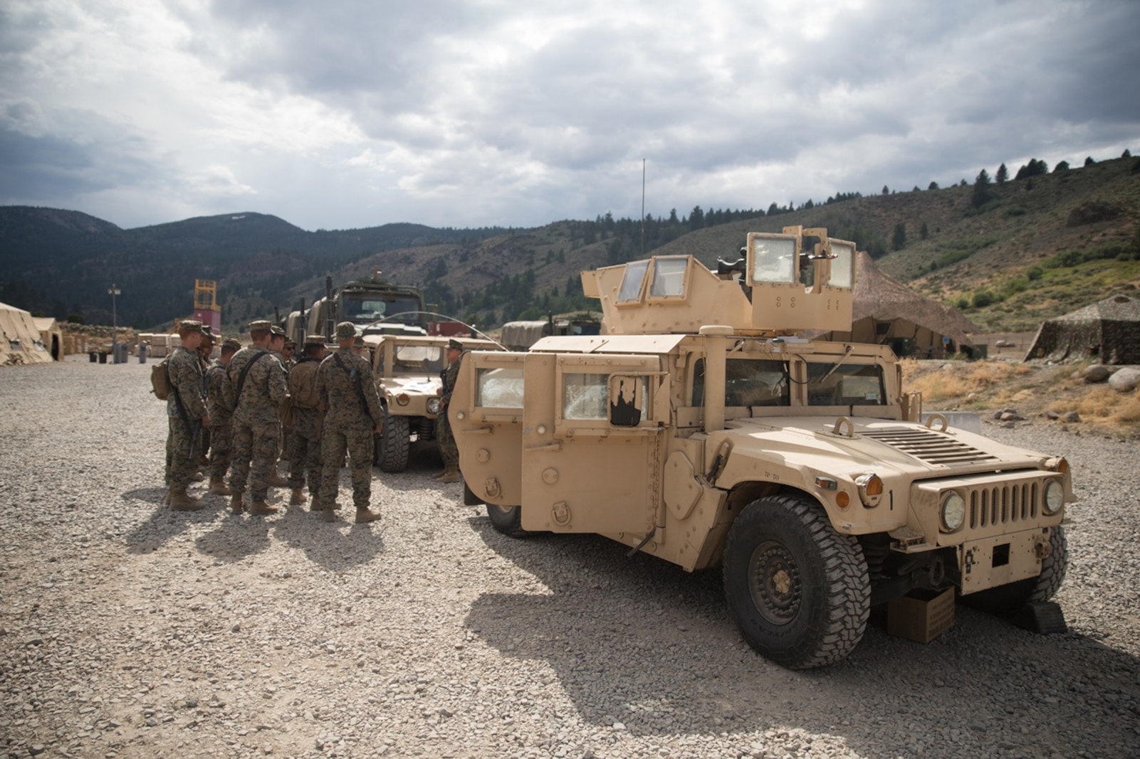 BRIDGEPORT, Calif. - U.S. Marines with Combat Logistics Battalion 5 (CLB-5), Combat Logistics Regiment 1, 1st Marine Logistics Group, receive a brief prior to a convoy during Mountain Training Exercise 4-17 at the Marine Corps Mountain Warfare Training Center Aug. 1, 2017. Information is passed down from the non-commissioned officers to the junior Marines to ensure they know where to go and what to do. (U.S. Marine Corps photo by Lance Cpl. Timothy Shoemaker)