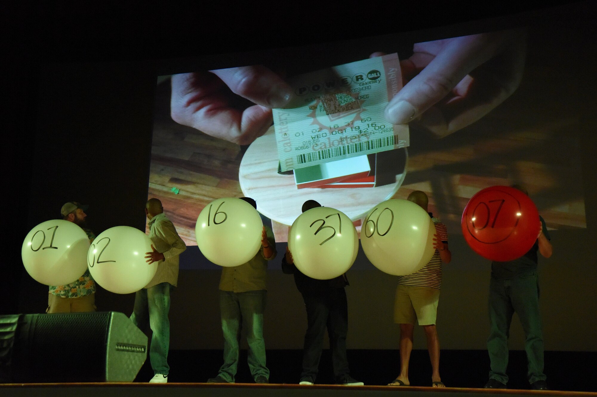 Keesler personnel participate in an illusion during the Mike Super’s Magic & Illusion show in the Welch Theater July 29, 2017, on Keesler Air Force Base, Miss. Super, an American magician who is the winner of the NBC show Phenomenon, is currently touring the U.S. and Canada with his illusion show. (U.S. Air Force photo by Kemberly Groue)