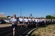 Members of the 150th Security Forces Squadron, 210th REDHORSE Squadron and other members of the 150th Special Operations Wing show their support and camaraderie for Staff Sergeant Robin Hopkins as she completes the final lap of her mile and half run on June 7, 2015.  Staff Sgt. Hopkins, a member of the Bernalillo County Sherriff department, was injured in the line of duty and was shot in the leg. This is her first PT test since that fateful incident. (U.S. Air National Guard photo by Master Sergeant Paula Aragon)
