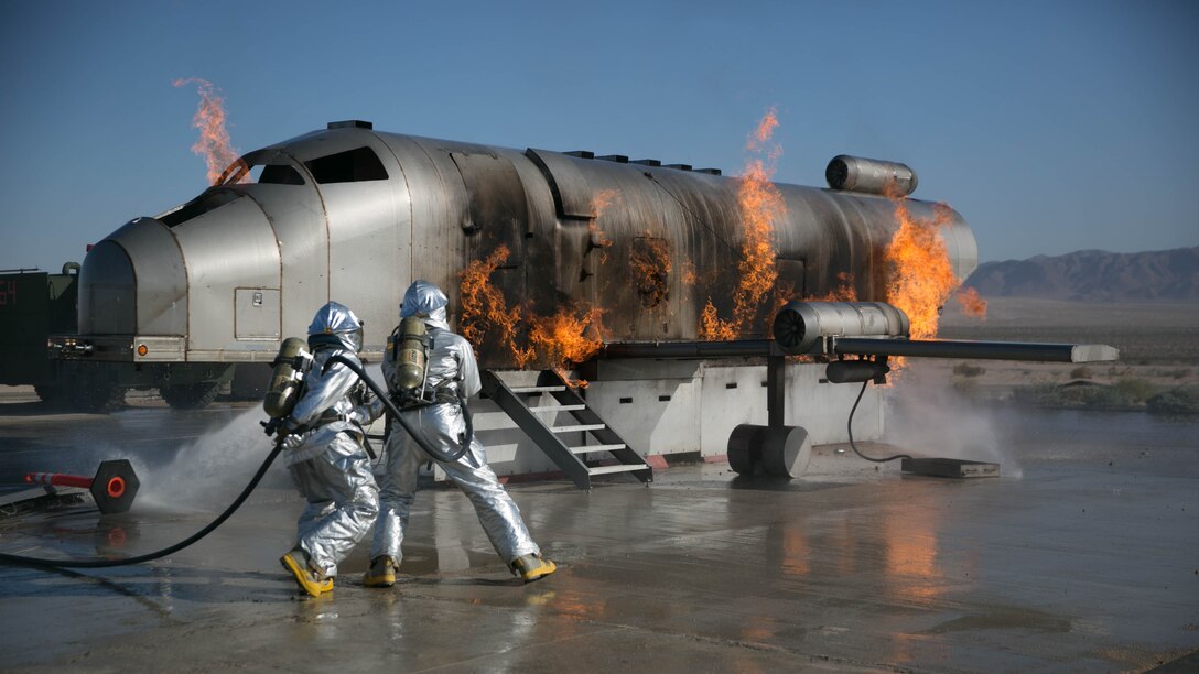 Marines with the Expeditionary Firefighting and Rescue team for Marine Wing Support Squadron 272, put out a simulated fire as part of a drill at the Combat Center during Integrated Training Exercise 5-17, July 29, 2017. MWSS-272 is supporting the Aviation Combat Element of the ITX. The ACE conducts offensive, defensive, and all other air operations to support the MAGTF mission .